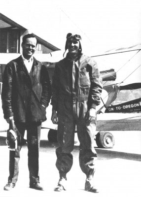 Laurence Lombard, left, and Frederick Blodgett prepare to depart Portland, Oregon, for Seattle. In the background is the Stinson “On-to-Oregon” that Tex Rankin of Portland was using to try to set an endurance record.