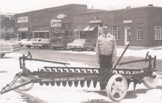 Francis Angell Standing Next To The Famous Angell Plow In Plains, KS (Source: Angell Family)