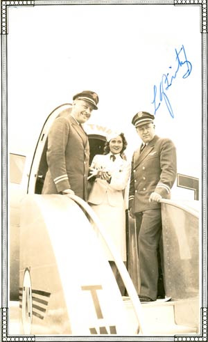 L.G. Fritz (R) With TWA Staff and Airplane, Date & Location Unknown (Source: Underwood)
