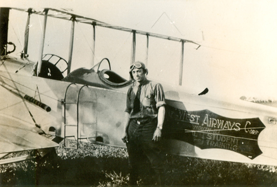 Livingston Standing By a Standard (J-1?) With Curtiss K-6 Engine