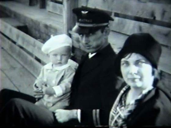 Pilot With Infant, and a Woman, Date & Location Unknown (Source: Havrilla)